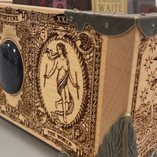 Video of Tarot and oracle deck organizer solid wood box with 12 removable slots engraved with Major Arcana Empress and zodiac symbols
