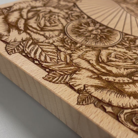 video of Dia de los Muertos altar table engraved on solid beech wood with floral and Holy Death sun moon motifs