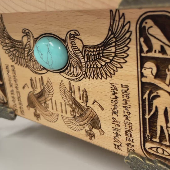 Close up of Weighing of the Heart engraving from Egyptian Book of the Dead on wooden altar box

