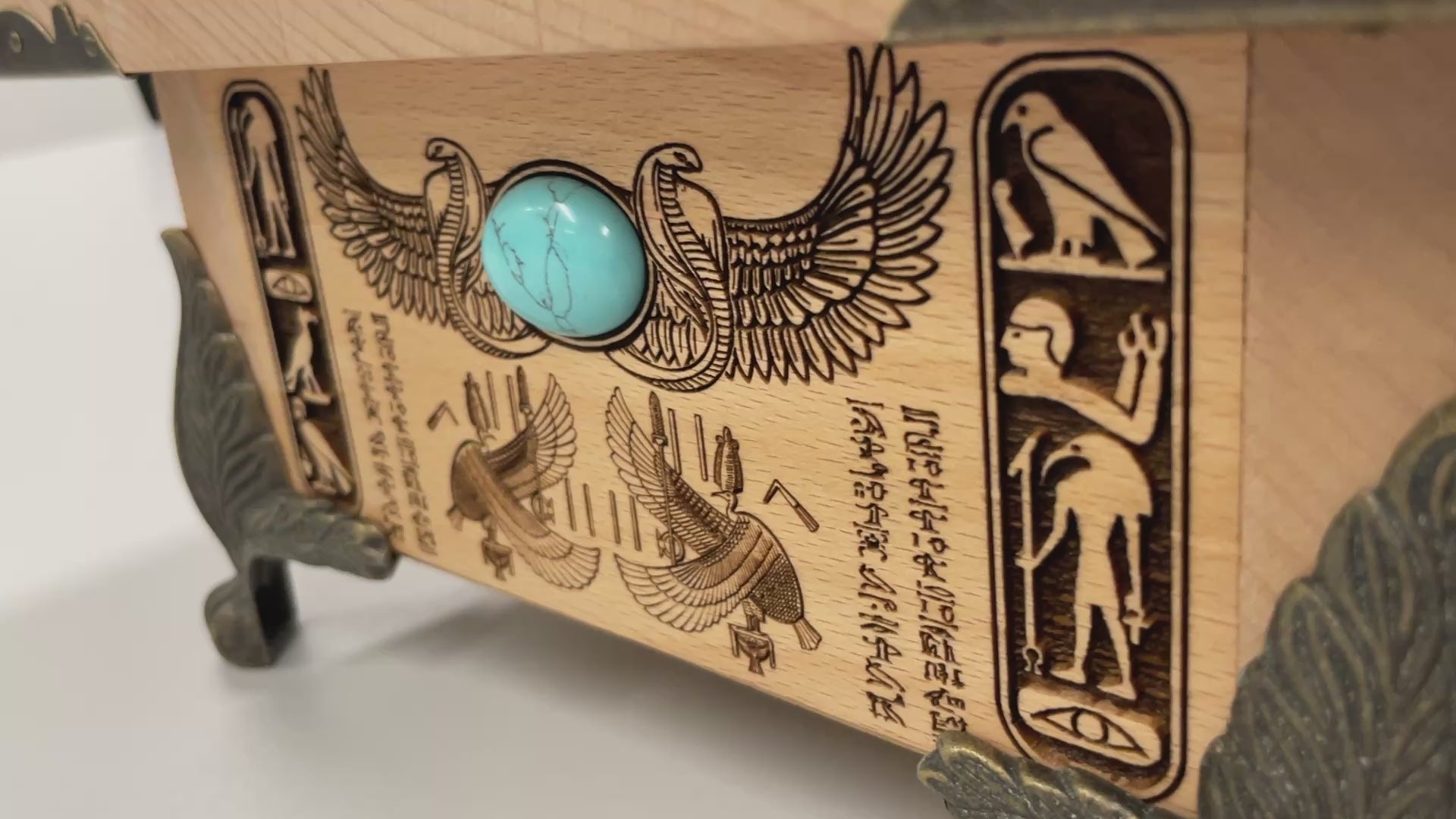 Close up of Weighing of the Heart engraving from Egyptian Book of the Dead on wooden altar box
