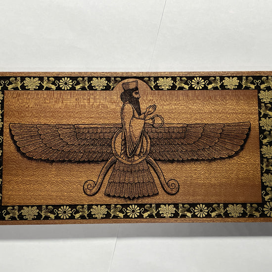 Video of Ahura Mazda Faravahar wall art engraved in solid mahogany wood, Zoroastrian Persian symbol with hand painted details, handmade spiritual wall decor
