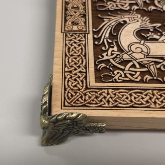 Close up of Freya Norse goddess engraving on wooden altar table
