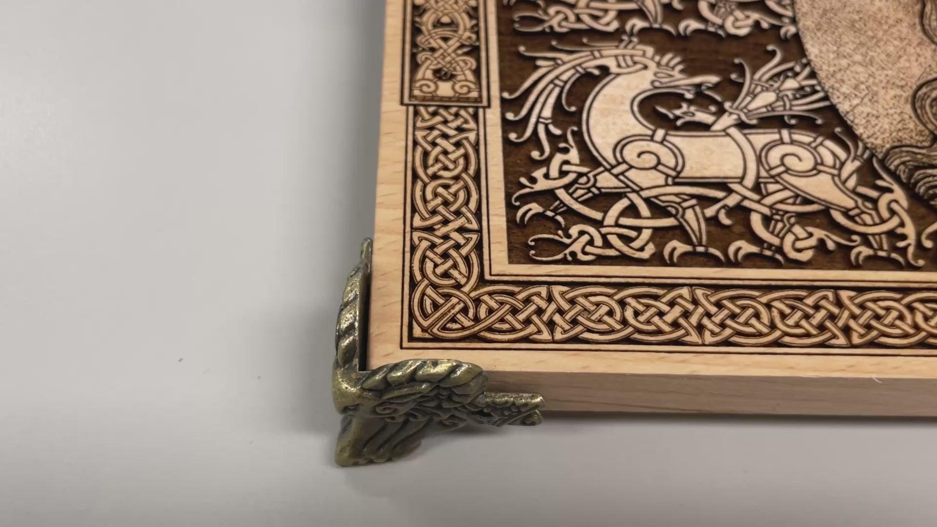 Close up of Freya Norse goddess engraving on wooden altar table
