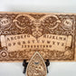 Gothic spirit board engraved with Baphomet symbol and classic Ouija markings, solid wood construction suitable for ritual practice, satanic altar use, and dark fantasy home decor
