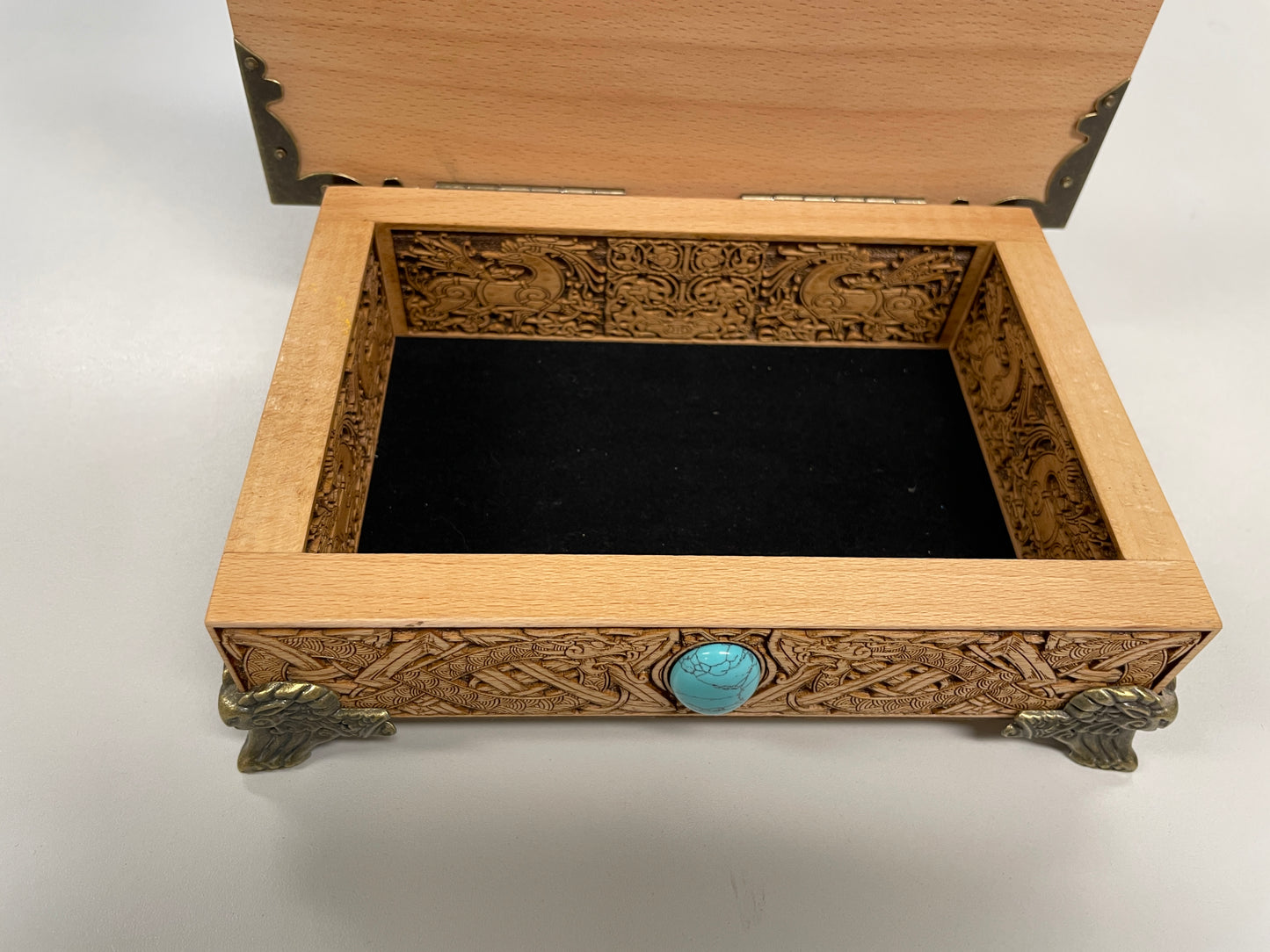 Close up of Odin engraving on Viking wooden altar and tarot box
