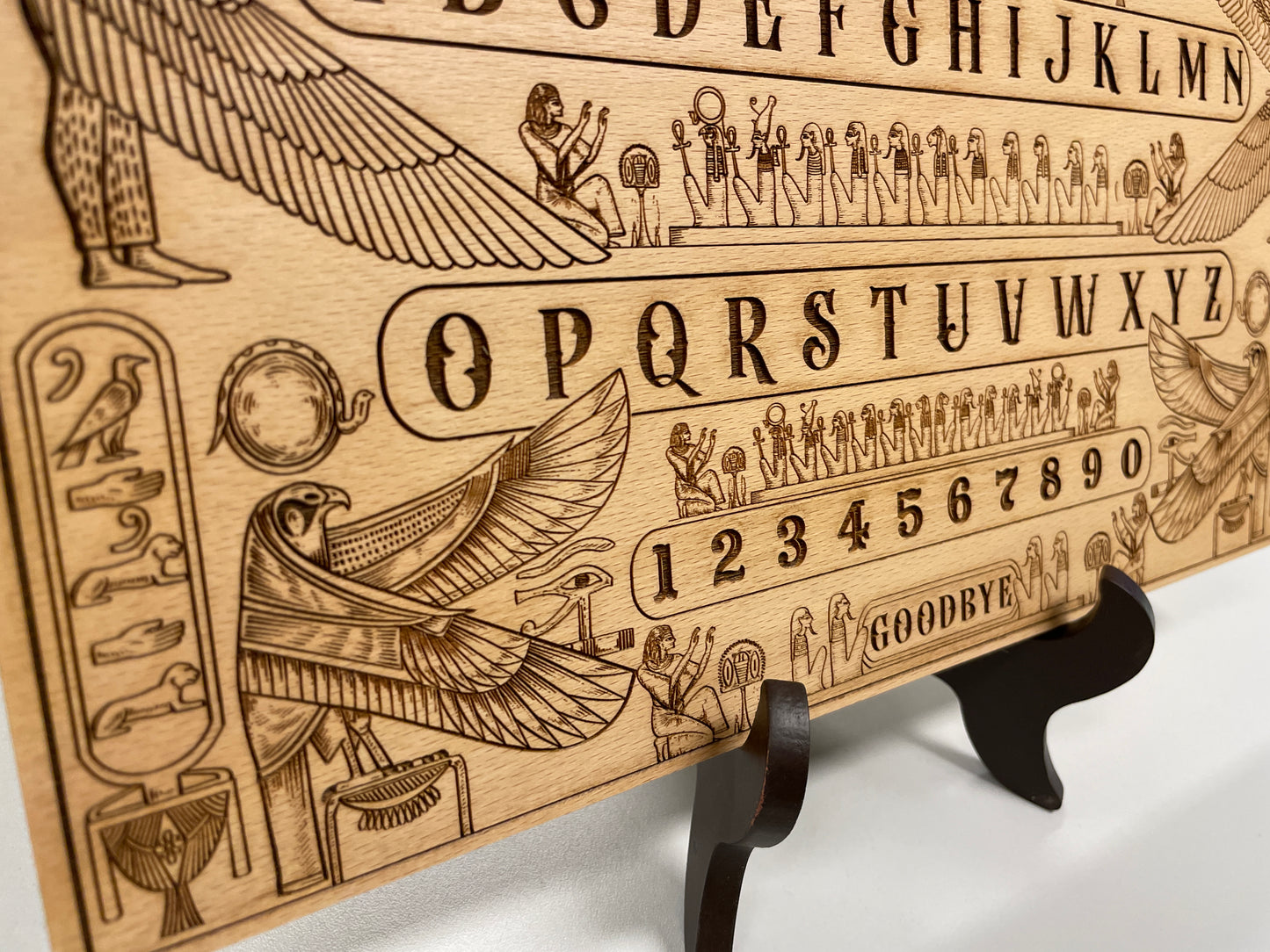 Egyptian mythology wooden Ouija board displayed as occult décor
