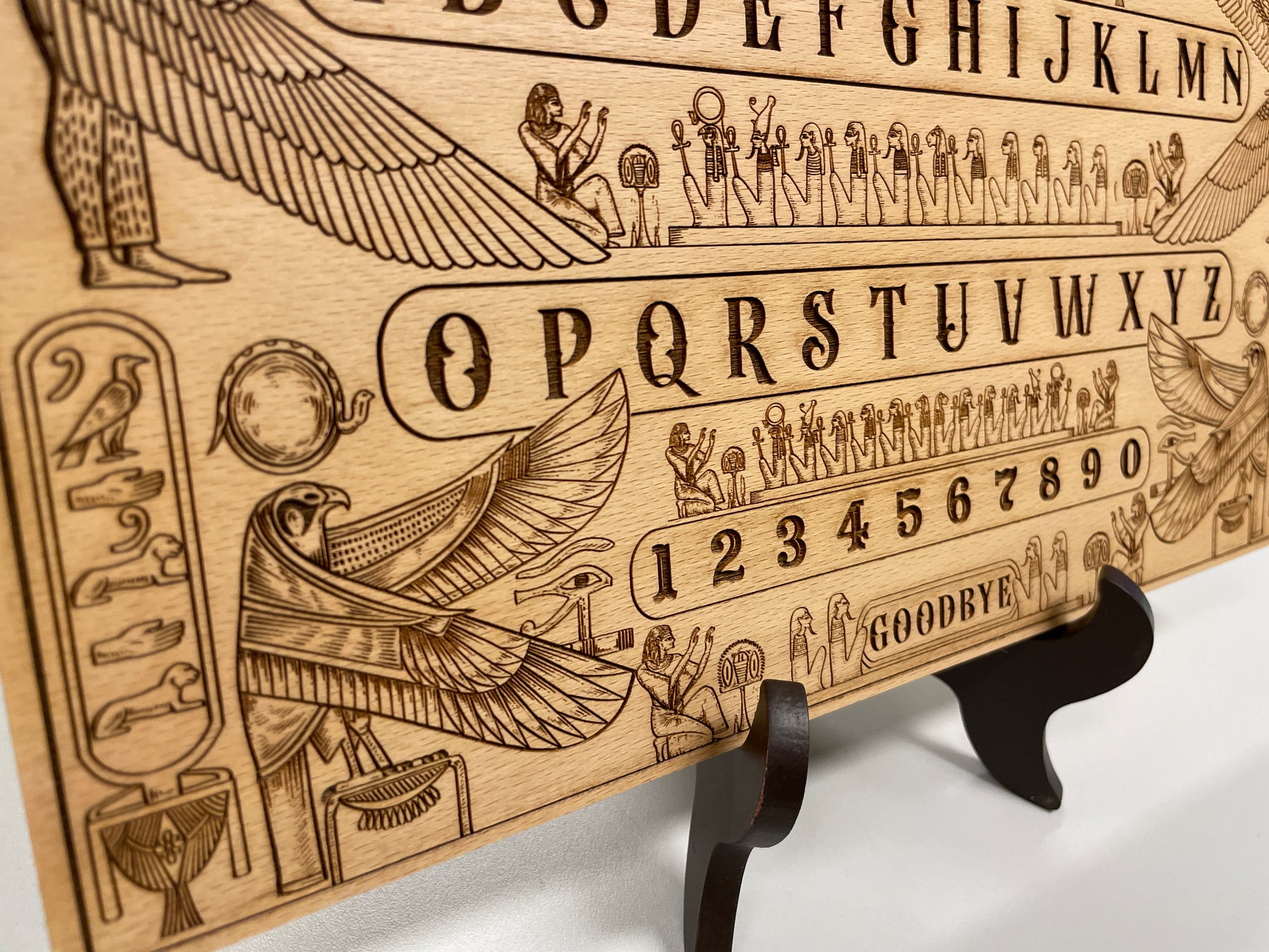 Egyptian mythology wooden Ouija board displayed as occult décor
