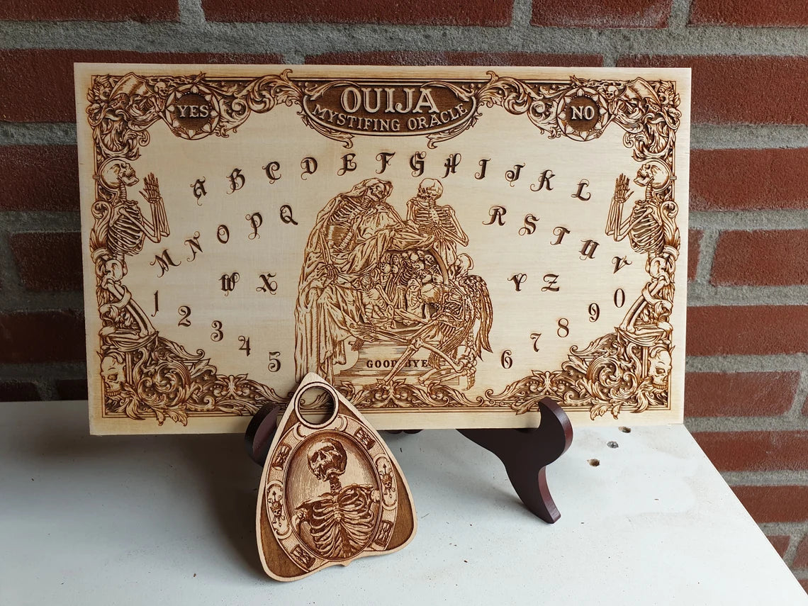 spirit board engraved in vintage gothic style with free planchette