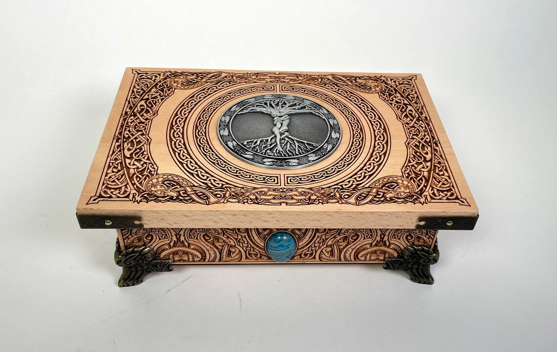 Close up of Yggdrasil Tree of Life engraving on Celtic Viking altar wooden box
