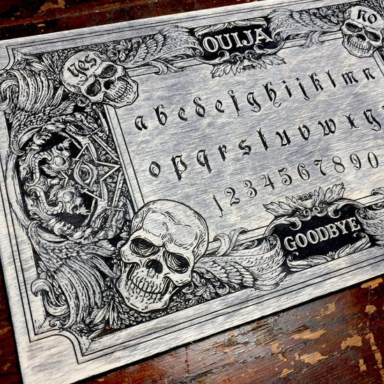 Dark Ouija board with demons and skulls wooden engraving with planchet ...