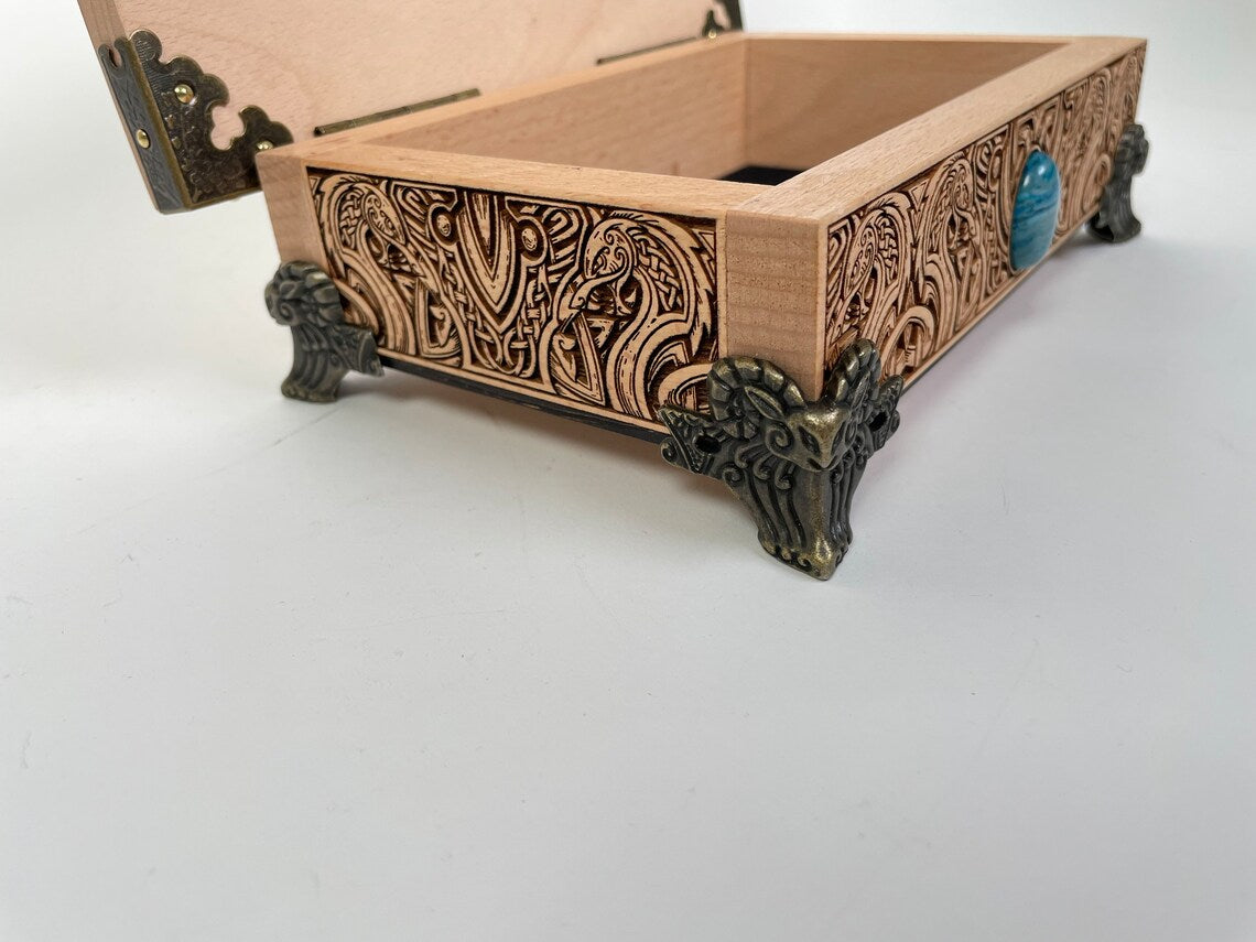 Open solid wood tarot box used on Viking altar for crystals and sacred items
