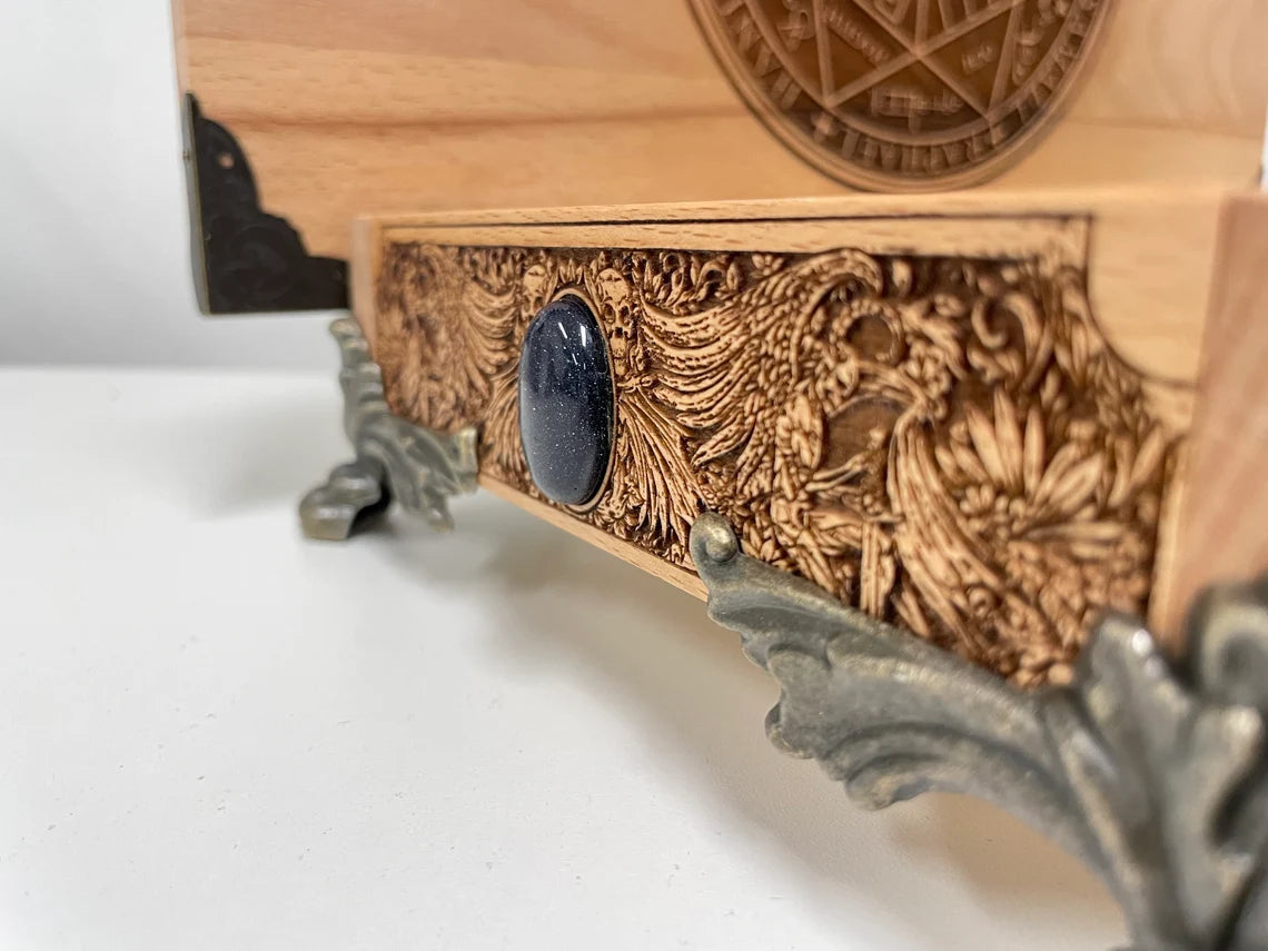 close up of Personalized Ouija board box set handmade in the Netherlands, engraved wooden spirit board with planchette and gothic occult design